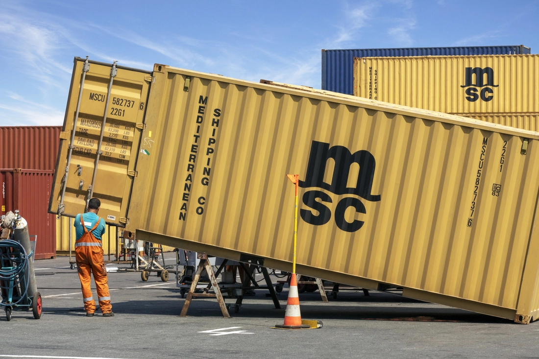 MSC shipping container being tipped for efficient bulk cargo discharge at a UK terminal