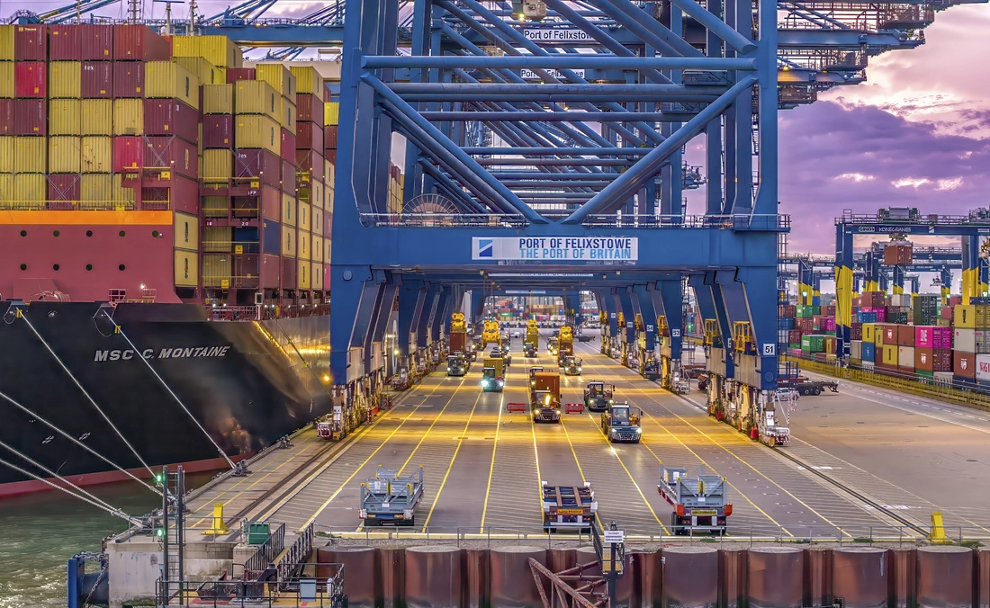 Container terminal operations at the Port of Felixstowe, with cranes, containers and vehicles handling cargo